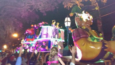 During Carnival, crowds gather to catch throws from fancy floats. 